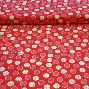 tela roja con estampado de circulos