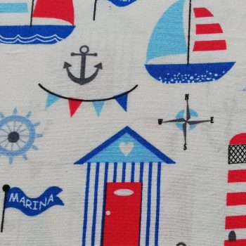 Tela infantil marinero** de algodón 100% con estampado de barcos, anclas y motivos del mar de 1,10m de ancho