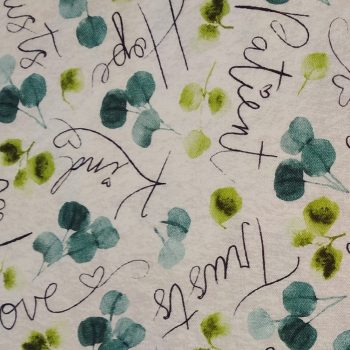 **Tela gris hojas y letras** de algodón 100% con un ancho de 1,10m para patchwork y costura creativa
