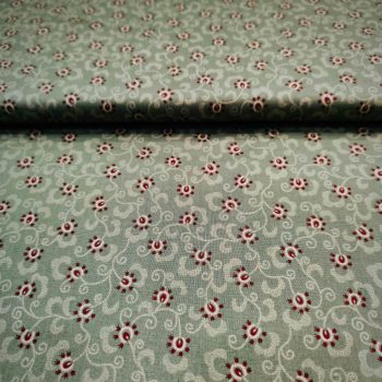 Primer plano de tela de patchwork Kim Diehl verde con efecto espolvoreado moteado, algodón 100% estilo country